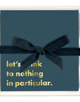 Elegant napkin holder gift set featuring Let’s Drink cocktail napkins and ribbon accent