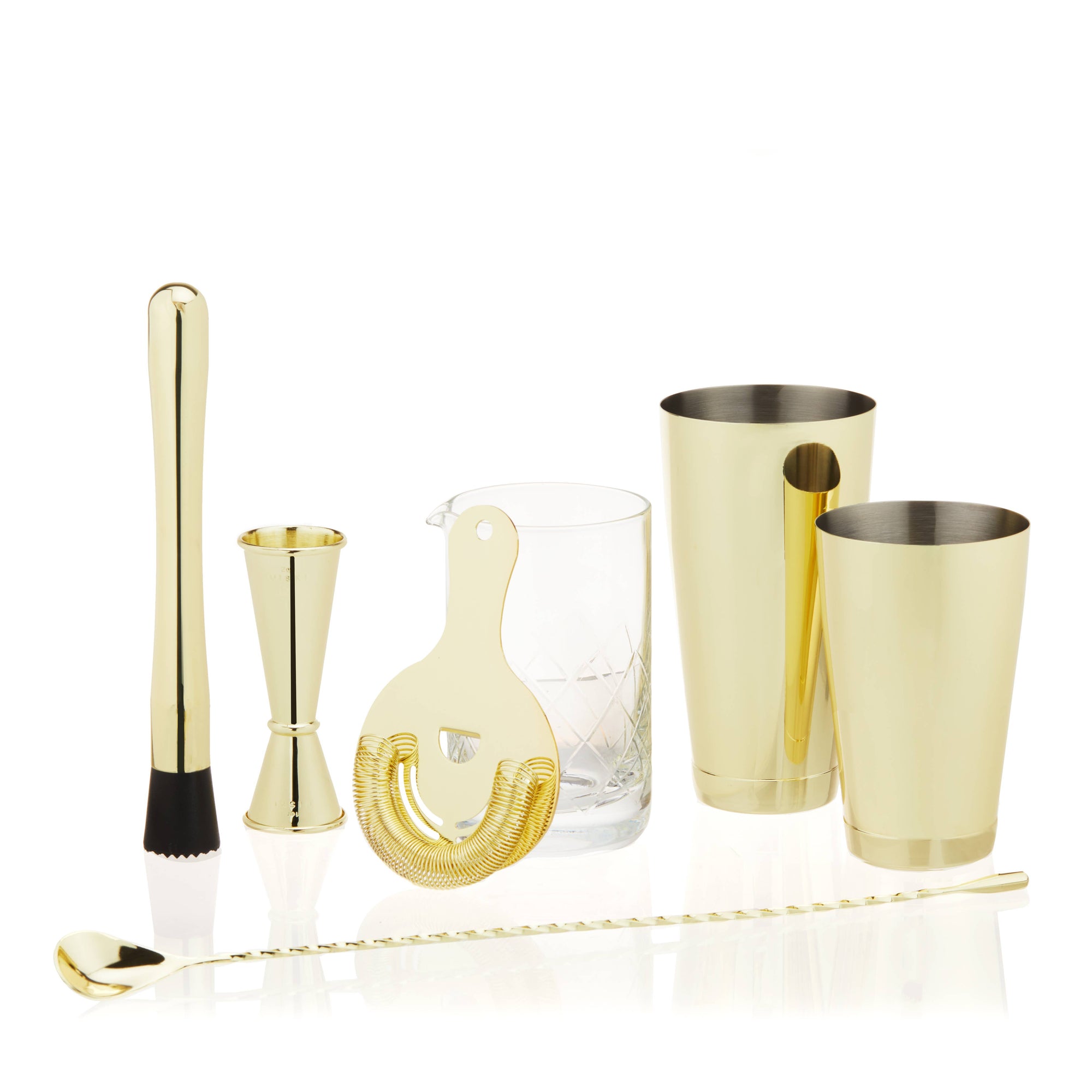 7-piece gold cocktail shaker set with mixing glass, tins, jigger, bar spoon, and muddler