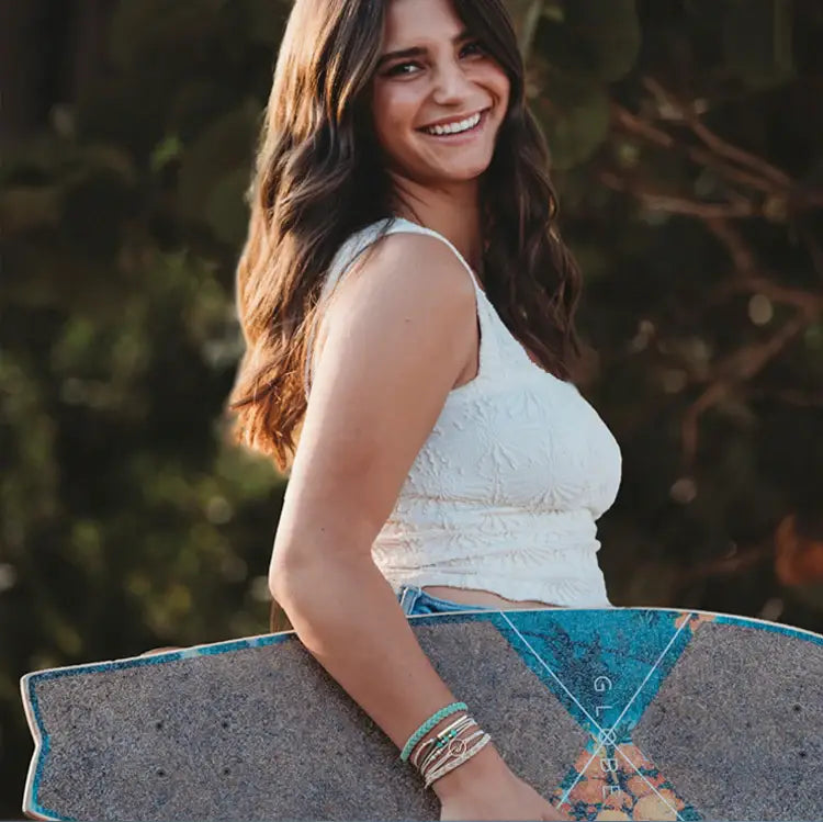 Stacked hair tie bracelets in earthy and soothing beach-inspired tones