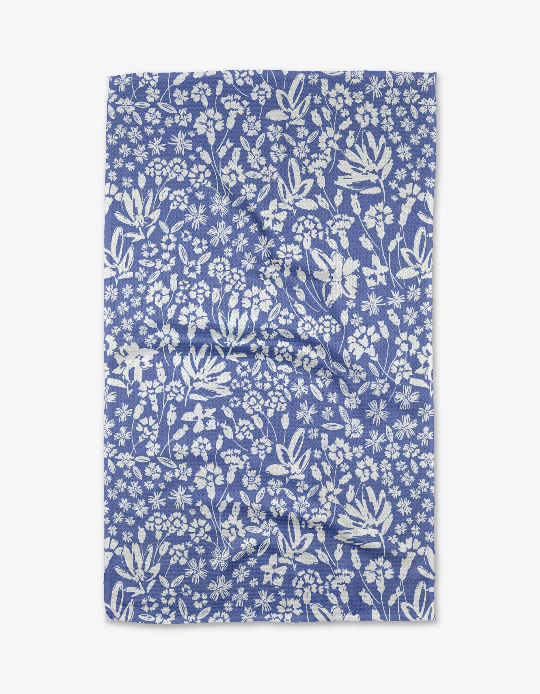 Bloom Me Over Floral Tea Towel made from recycled polyester hanging in kitchen
