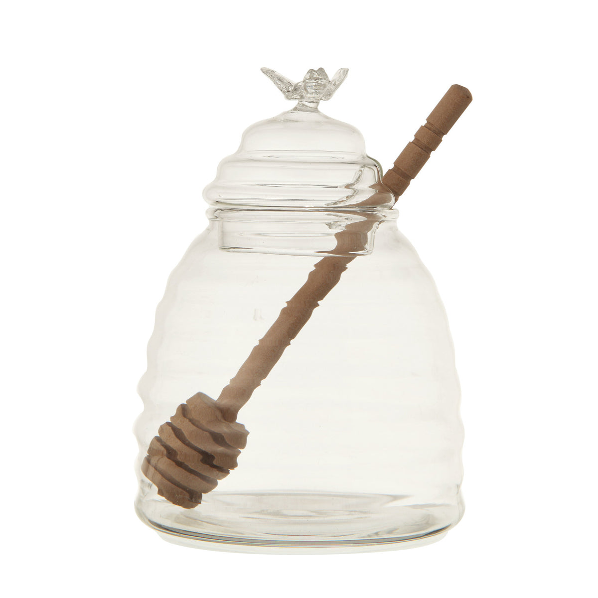 Clear glass honey pot with bamboo dipper for serving honey