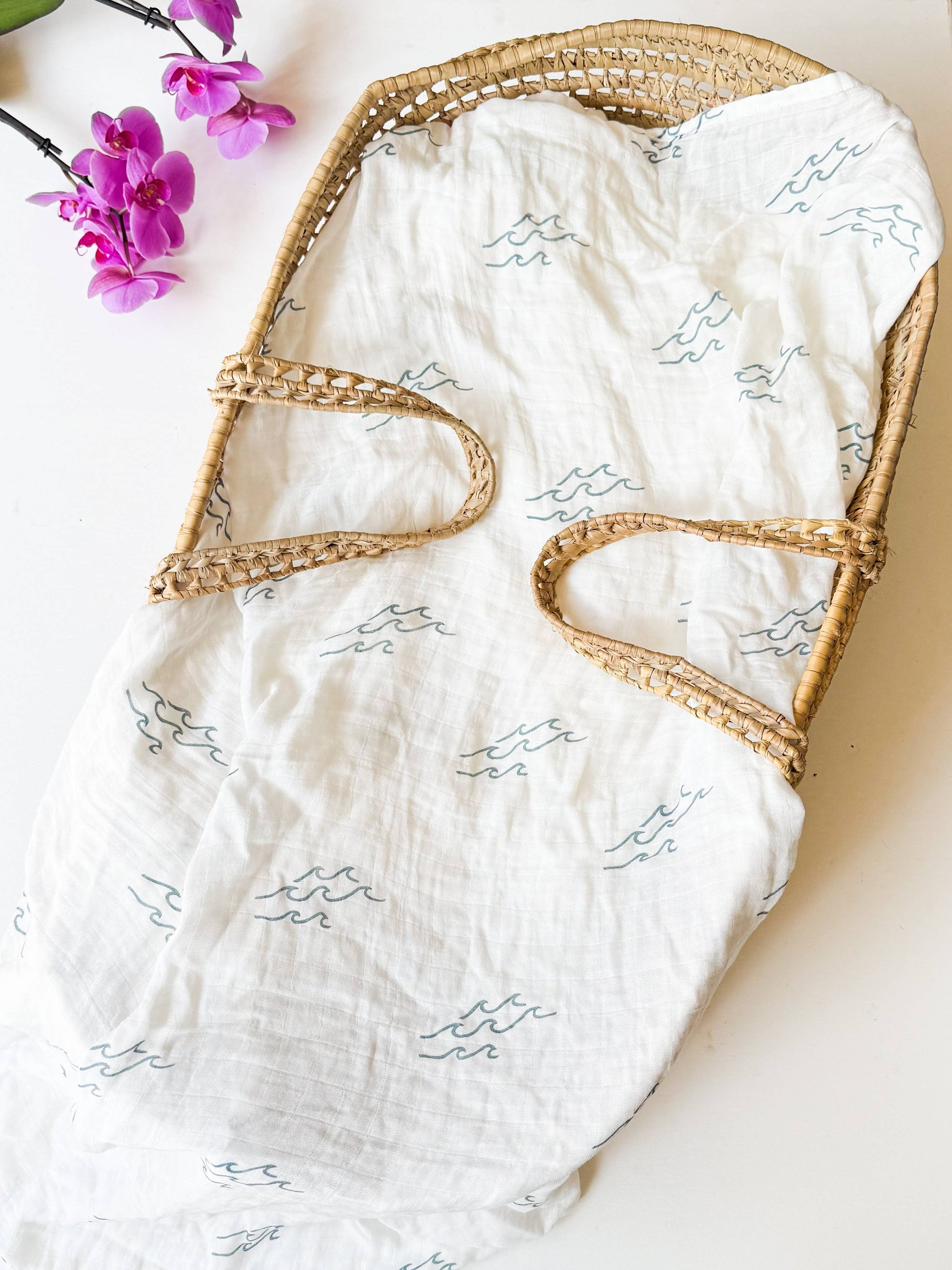 47-inch square Coastal Wave Swaddle Blanket in organic bamboo and cotton with hand-carved block print wave motif, gift-ready