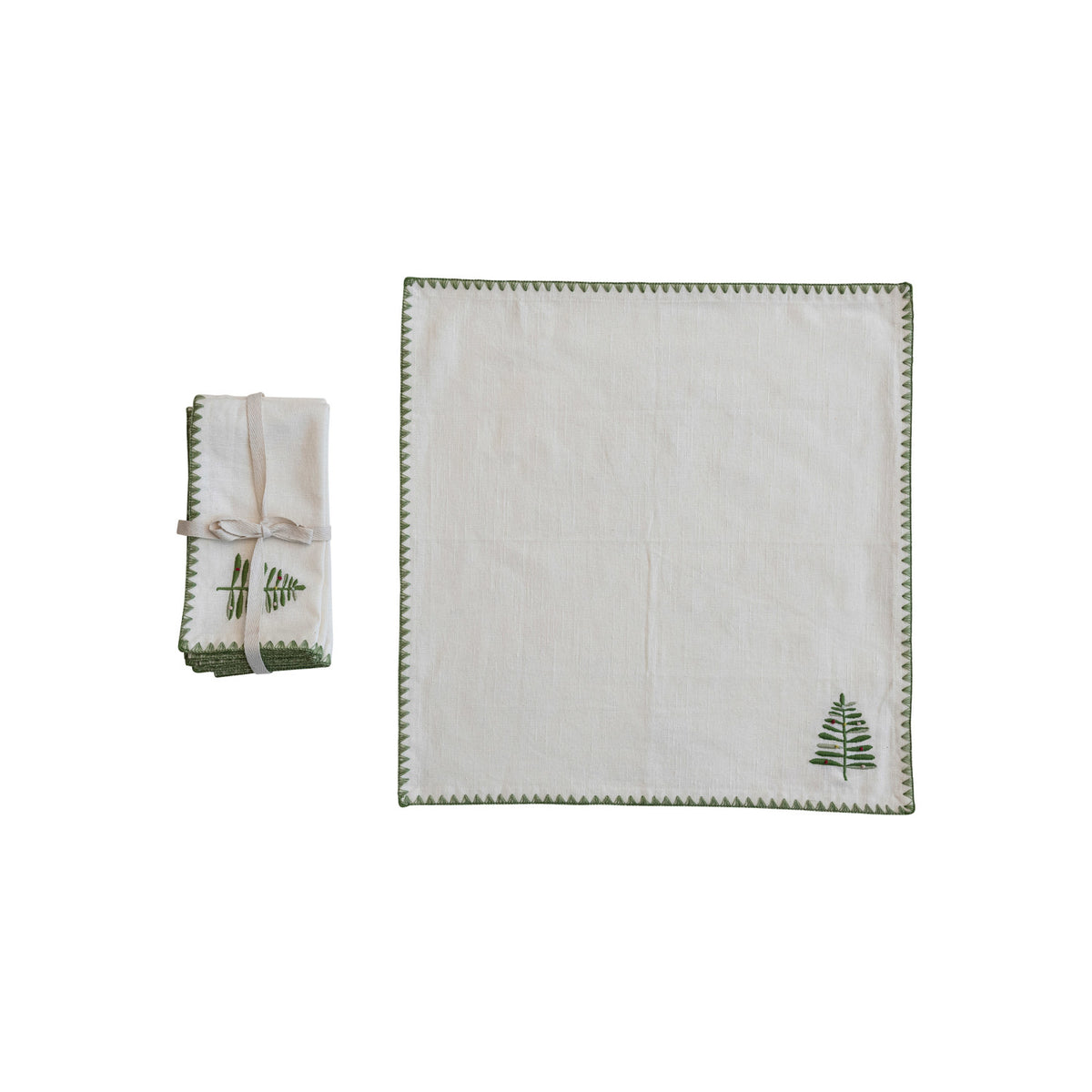 Set of four cotton napkins with green embroidered tree and edge on natural background, holiday table linens