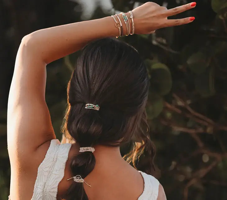 Stacked hair tie bracelets in earthy and soothing beach-inspired tones