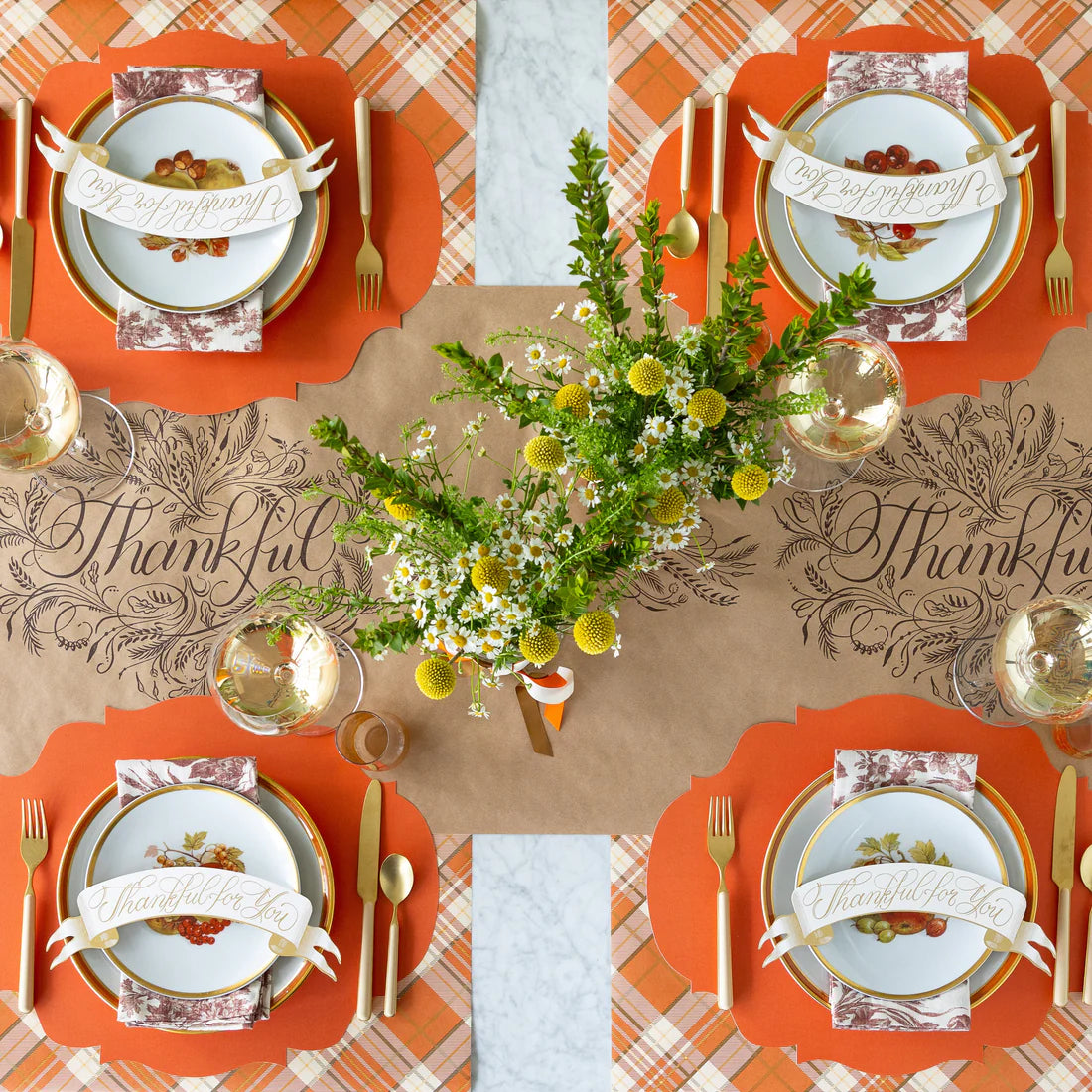 Eco-friendly kraft paper table runner with ‘Thankful’ design for holiday dining.