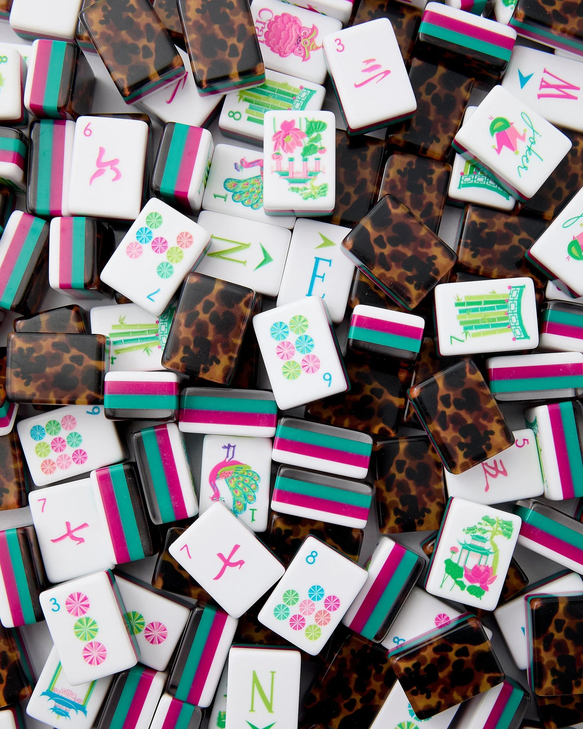 Collection of colorful mahjong tiles with various designs and patterns.