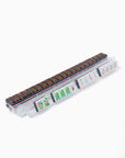 Rectangular container with a patterned top and colorful labels on a white background