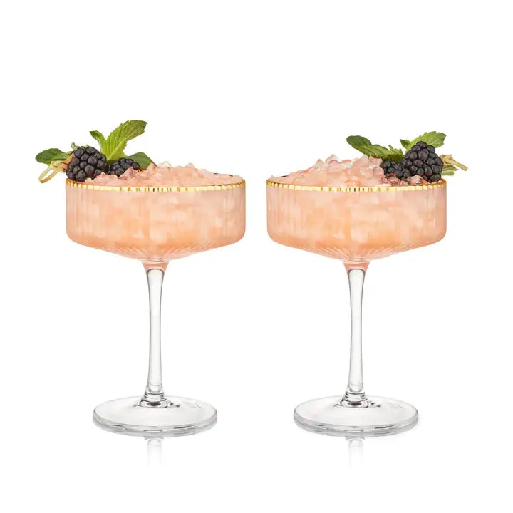 Pair of 11.5 oz gold-rimmed stemmed crystal coupe glasses with sleek rippled texture for cocktails