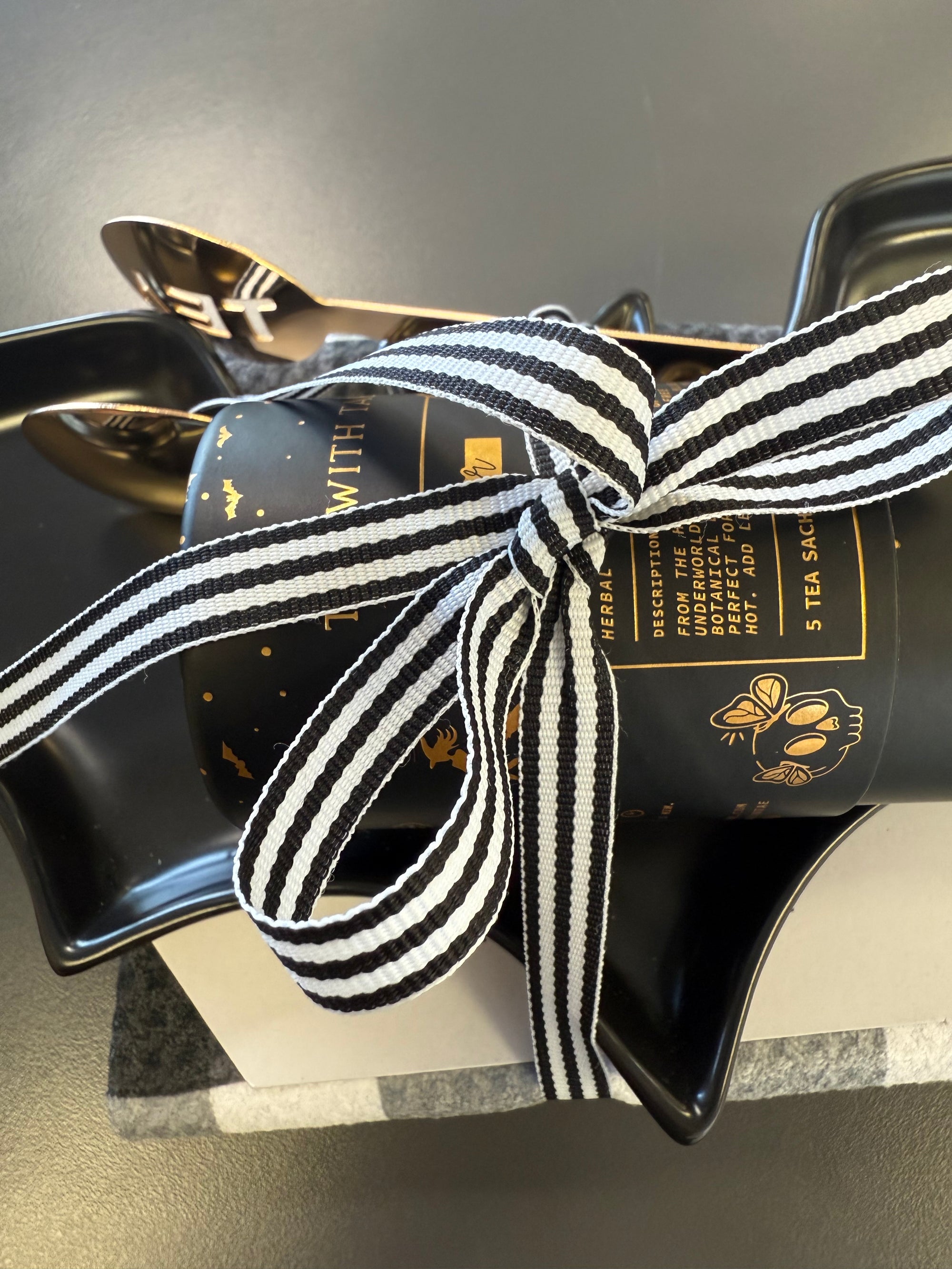 Pre-packaged Halloween gift set with festive treats and décor items