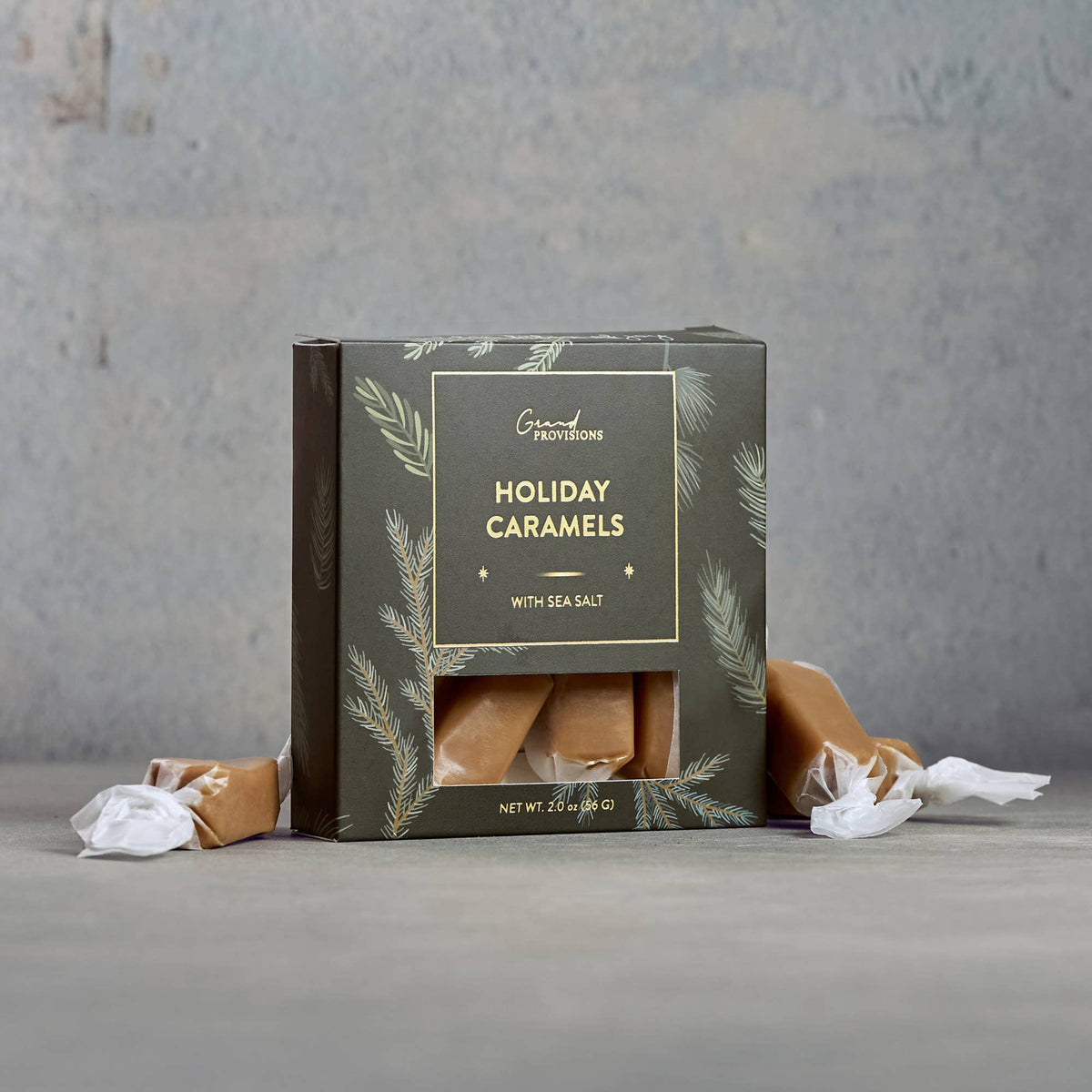 Creamy sea salt caramels in festive holiday packaging, 2 oz gift box.