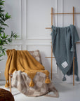 Soft checkered teddy blanket with plush texture, perfect for cozy winter nights